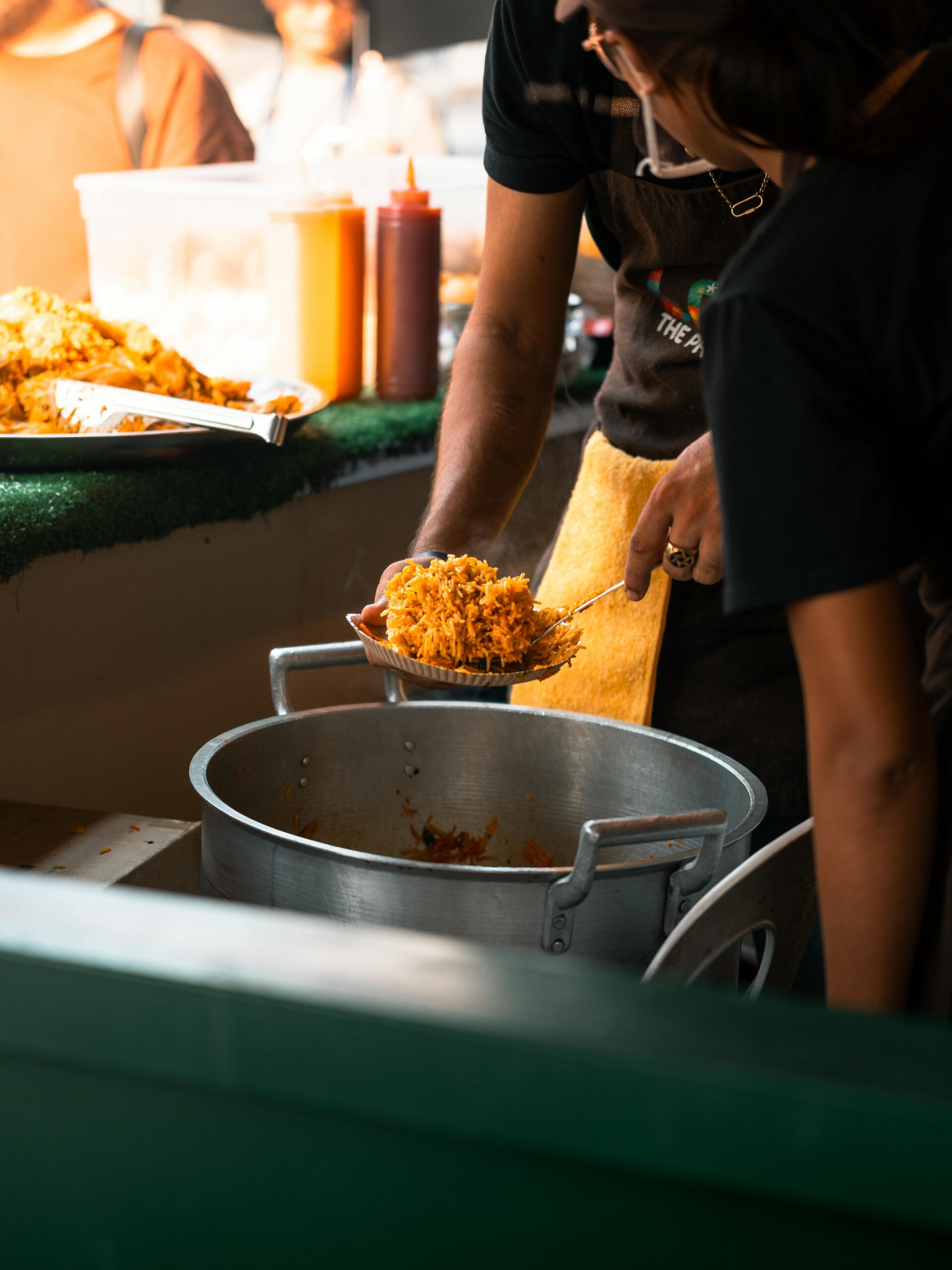 A vibrant street food scene in Manila showcasing local Filipino cuisine being served.